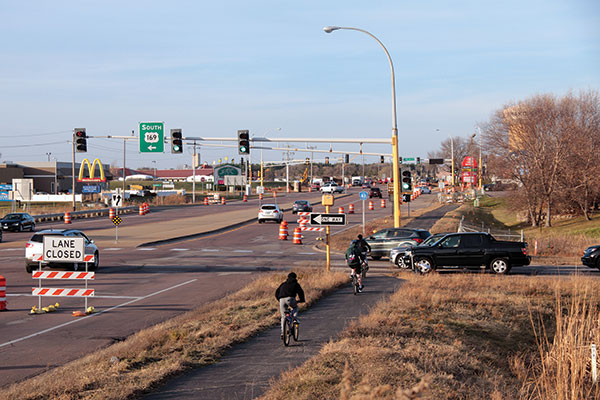 Vehicles and cyclists on highway