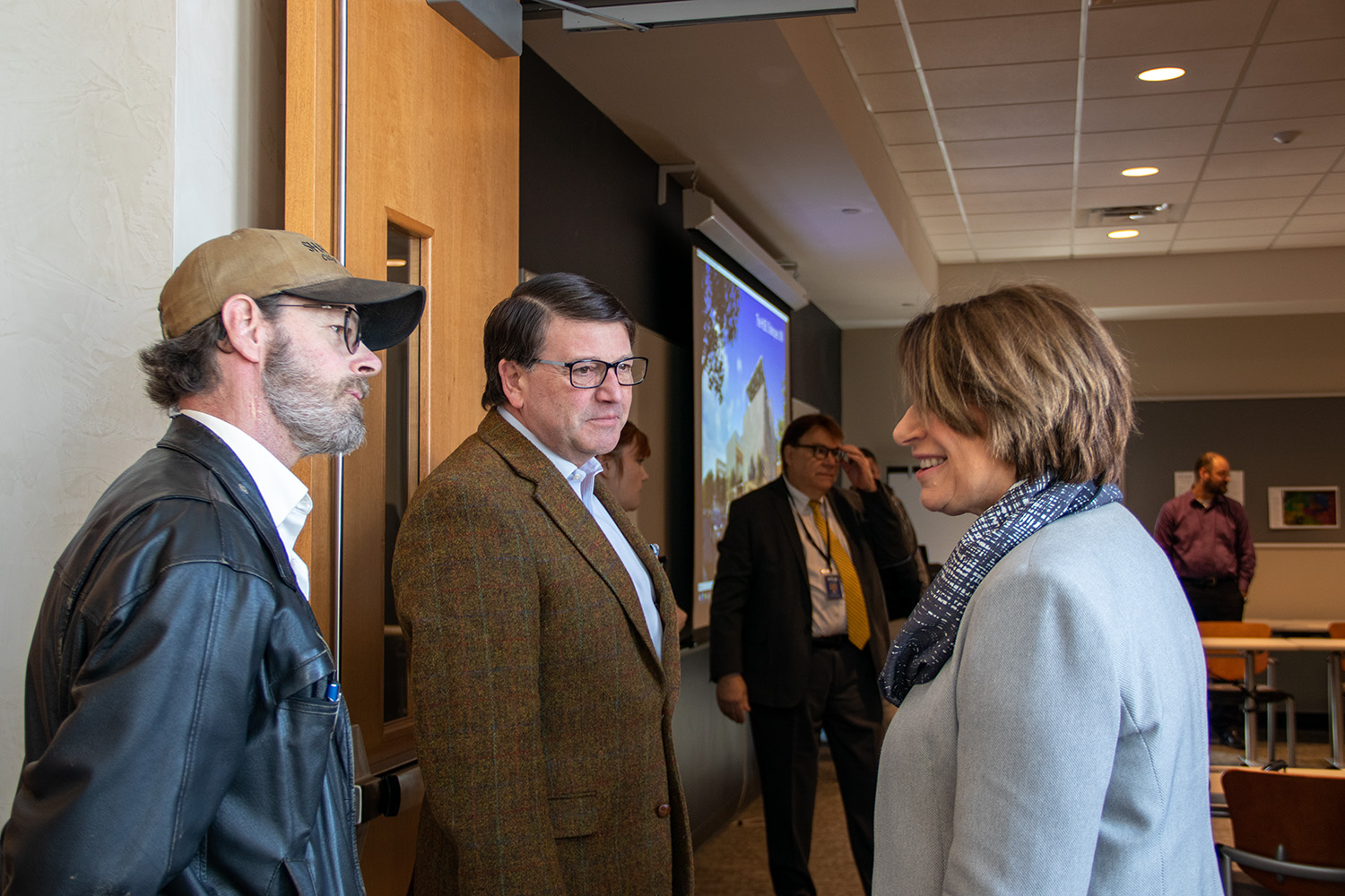 Mayor Matt Lehman, left, and City Administrator Bill Reynolds greet Sen. Amy Klobuchar at Shakopee City Hall.