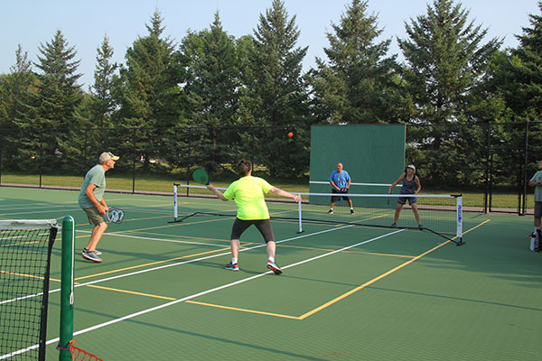 people playing on pickleball courts