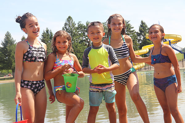 Five kids smiling at camera