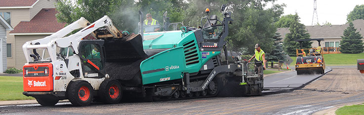 Paving machine and roller